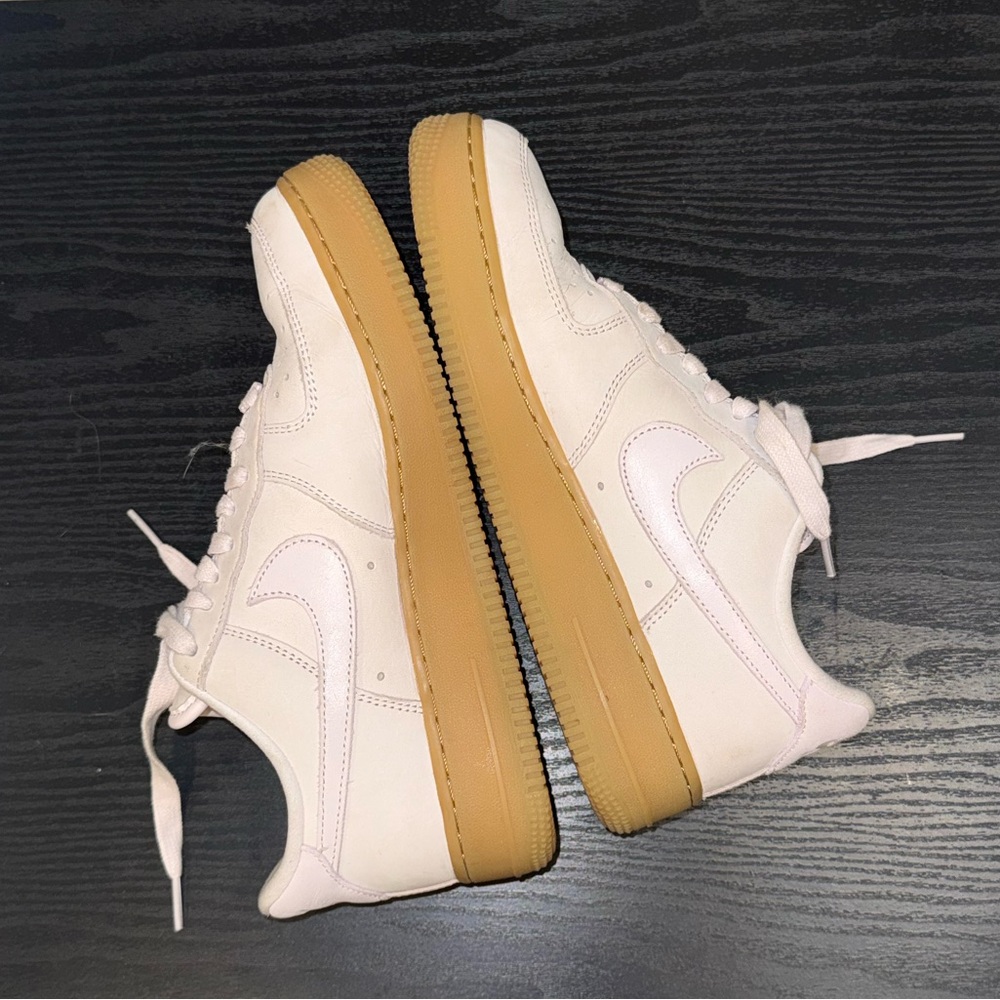 Pearl pink Nike Air Force 1 PRM model with gum soles